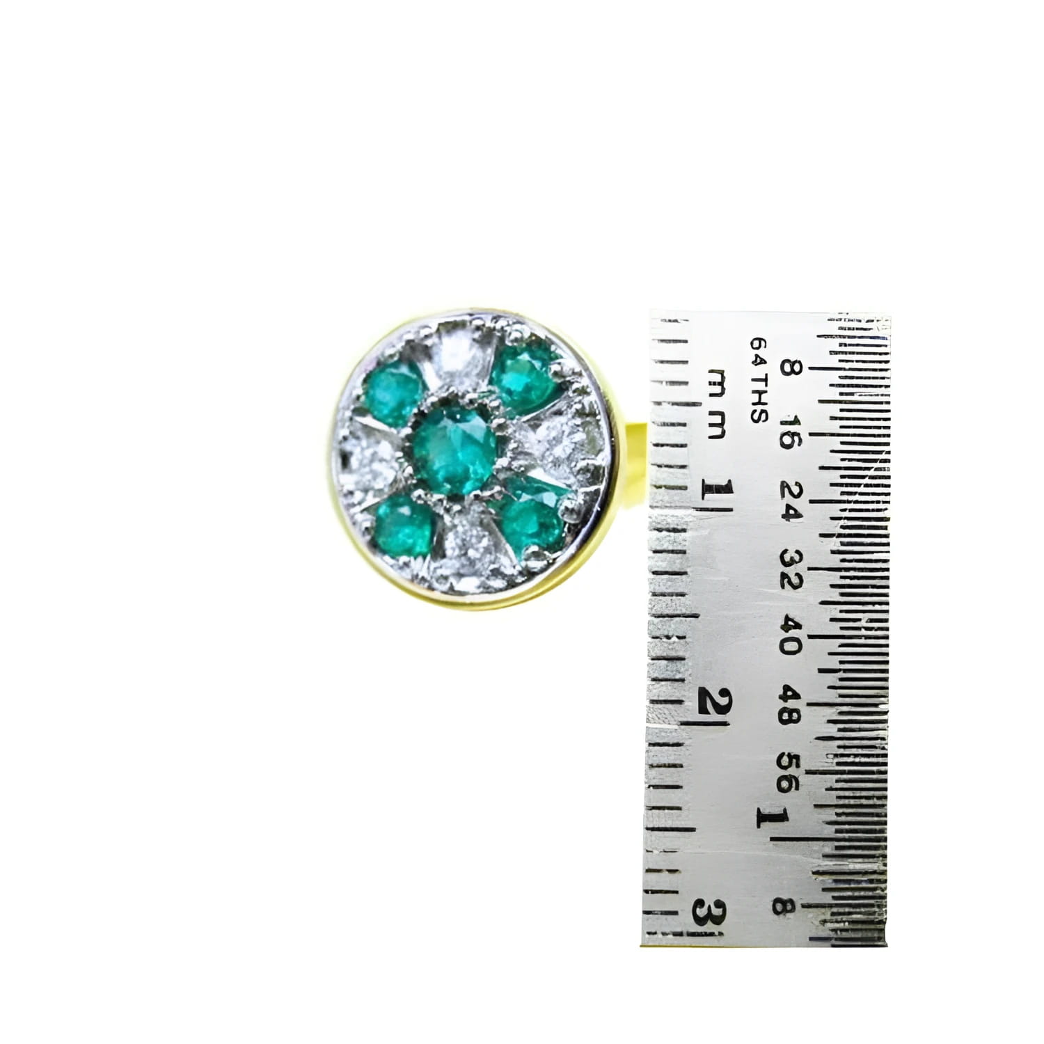 Round gold men's cufflink with natural emeralds and diamonds, shown next to a ruler for size.