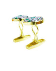 Gold cufflinks with genuine emerald and diamonds on a white background.