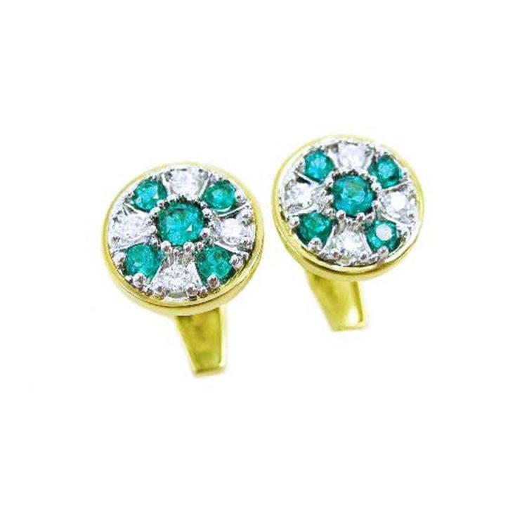 A pair of yellow gold colombian emeralds and diamond cufflinks round design.