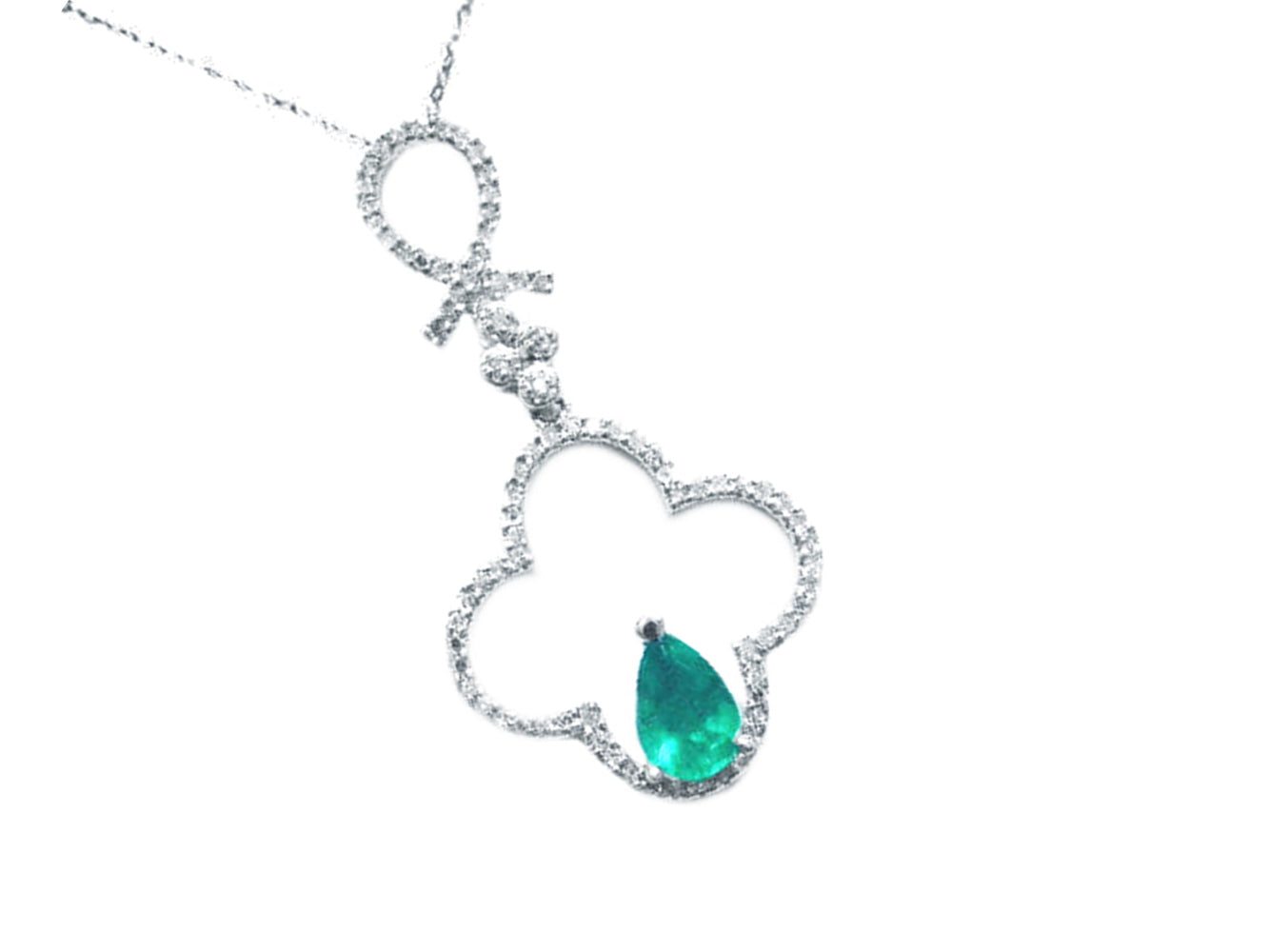 White gold necklace with an emerald teardrop pendant in four leaf clover pendant design with diamonds.