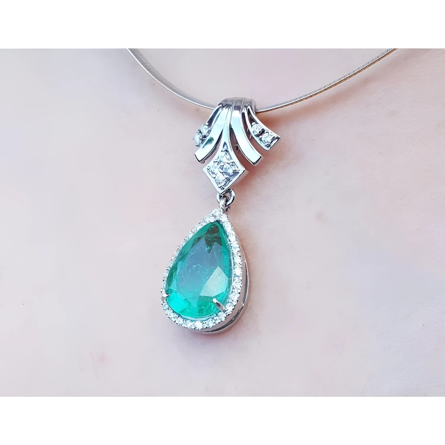 Women's emerald enhancer necklace pear cut emerald 6.01 carats encircle by a halo of natural diamonds