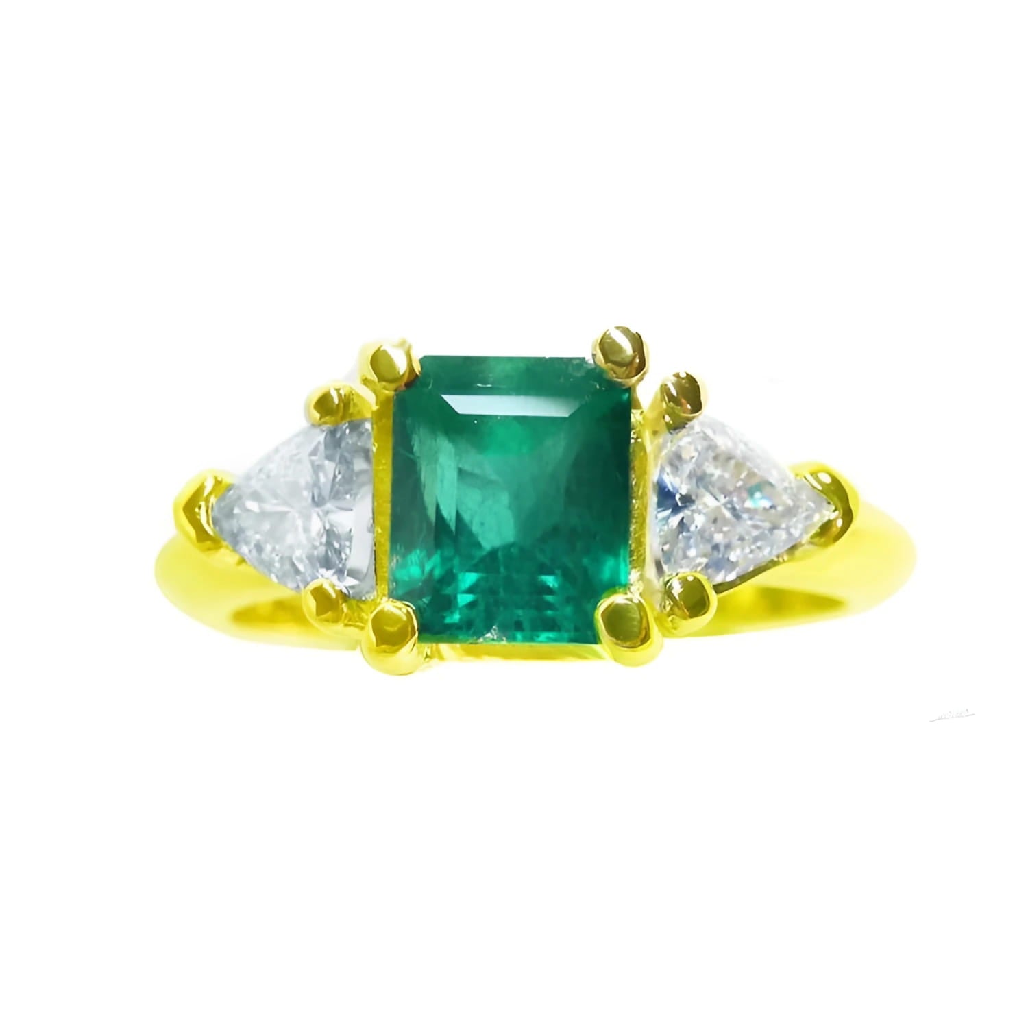1.48 ct emerald and trillion side diamond ring in 18K gold.