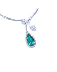 front view of a white gold necklace with a natural Colombian teardrop emerald pendant on a white background