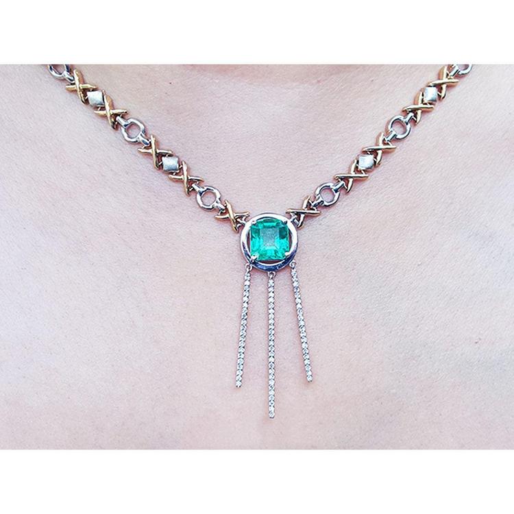 14K white and yellow gold Kisses and Hugs necklace with a square emerald pendant and diamond dangles.