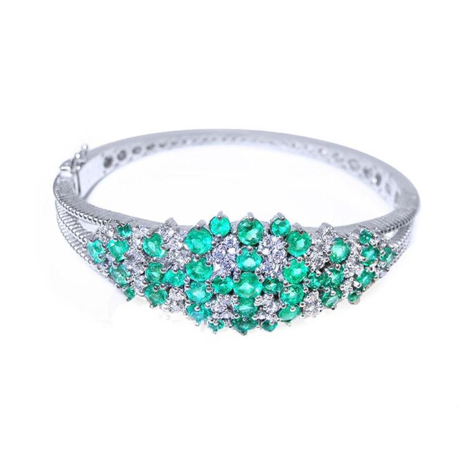 14k white gold bangle bracelet with round Colombian emeralds and diamonds.