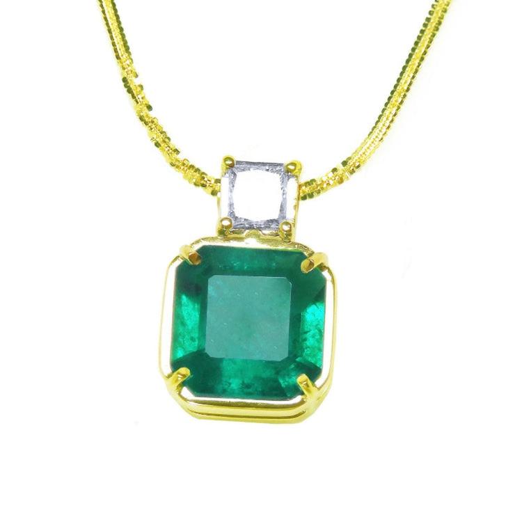 Asscher cut Colombian emerald necklace with a princess cut diamond on an 18K yellow gold chain.