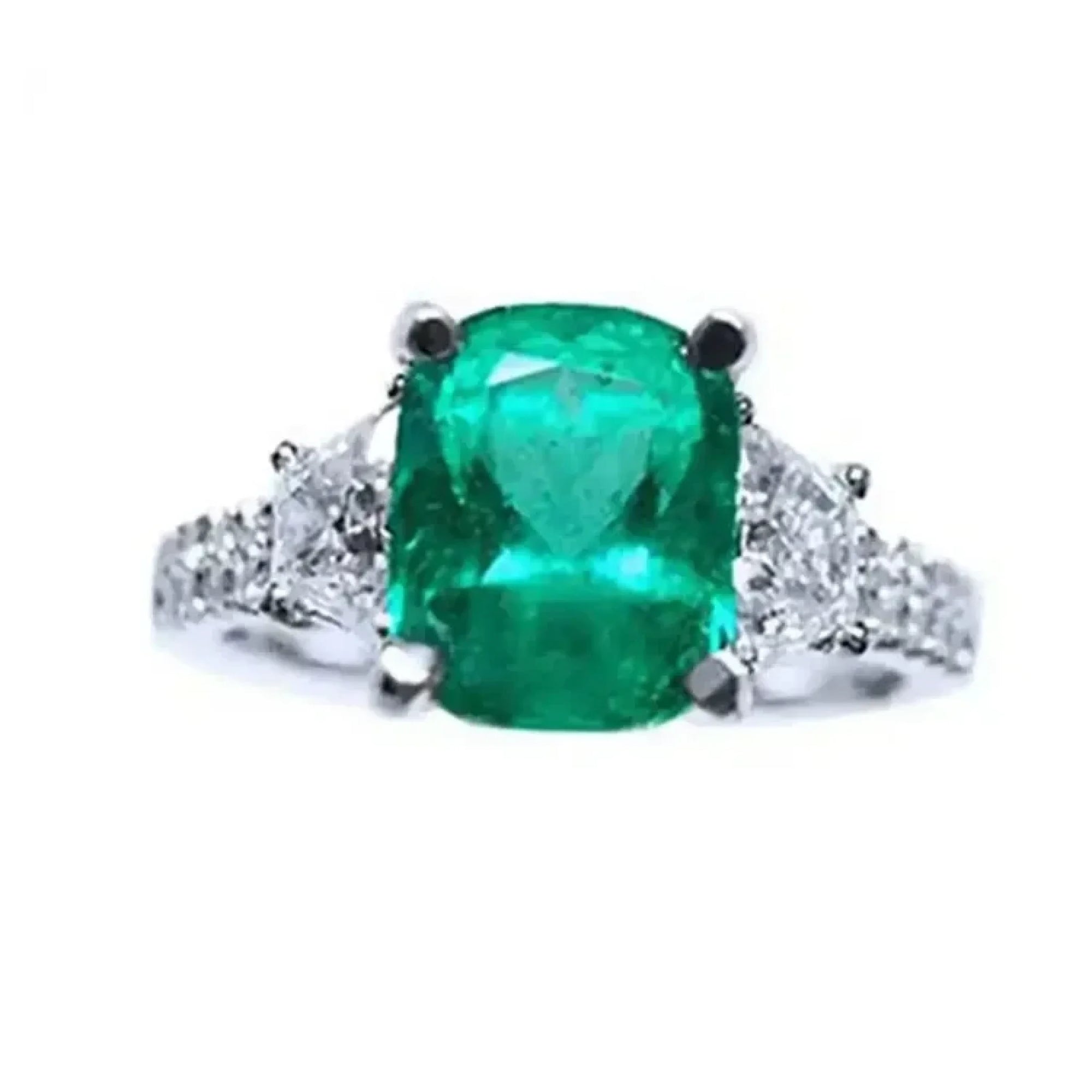 Anillo de compromiso con esmeralda colombiana corte cojín y diamantes naturales en oro blanco de 18k.