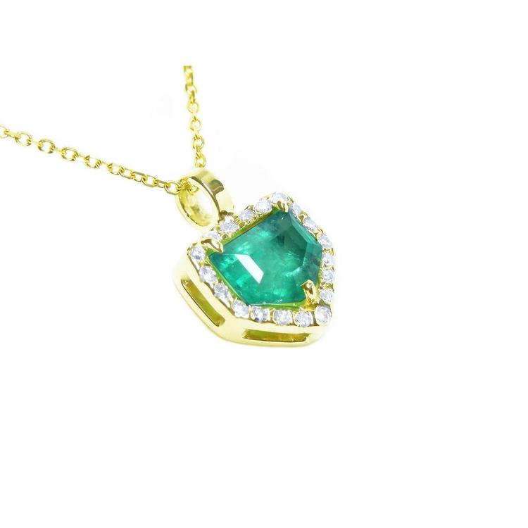 Gold necklace with a genuine colombian emerald pendant on a topside and gallery view.