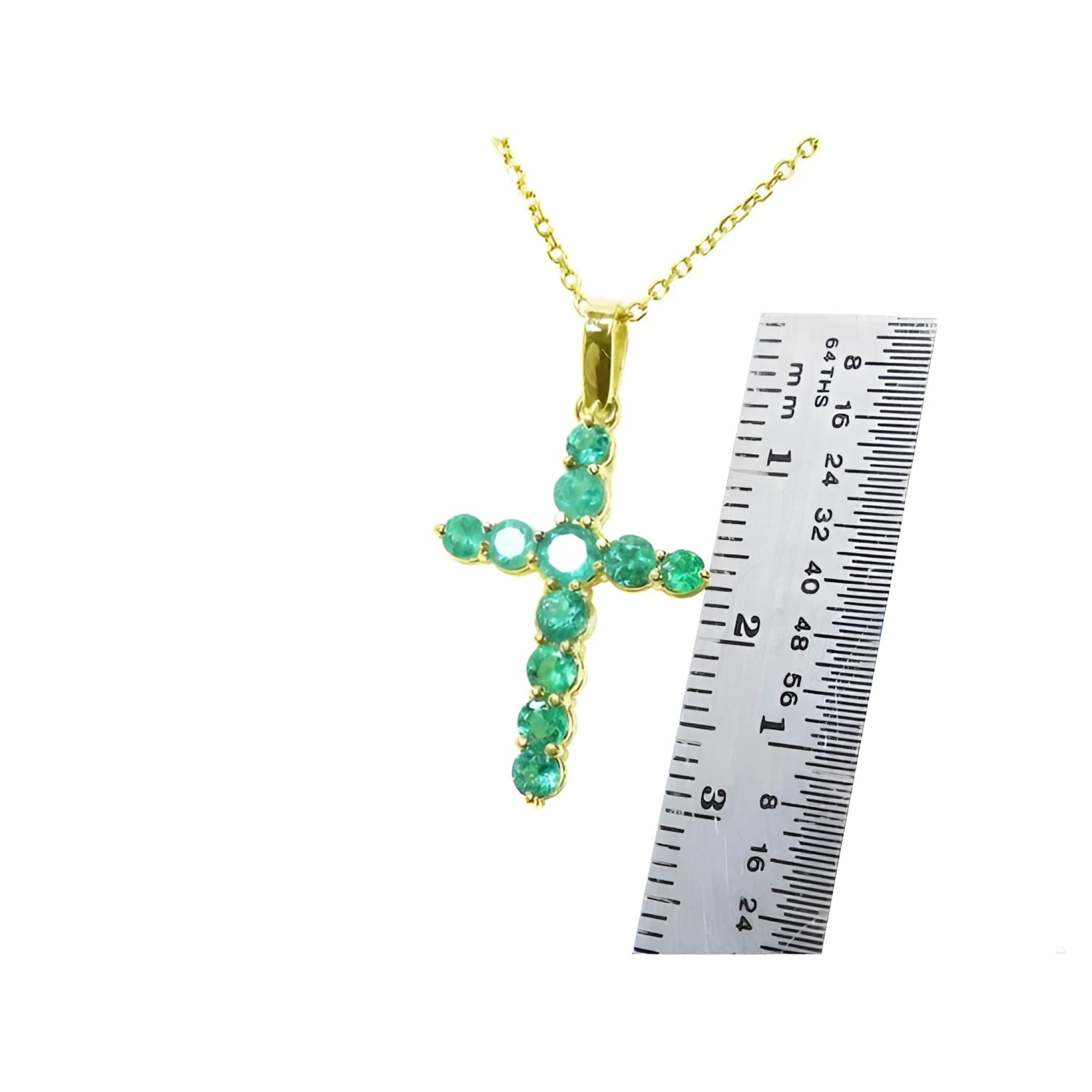 1.15 ct. genuine emerald cross pendant necklace in 18K yellow gold, shown with a ruler for scale.