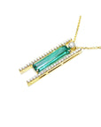 14K yellow gold necklace with a baguette-cut emerald, surrounded by natural diamonds, on a delicate chain.