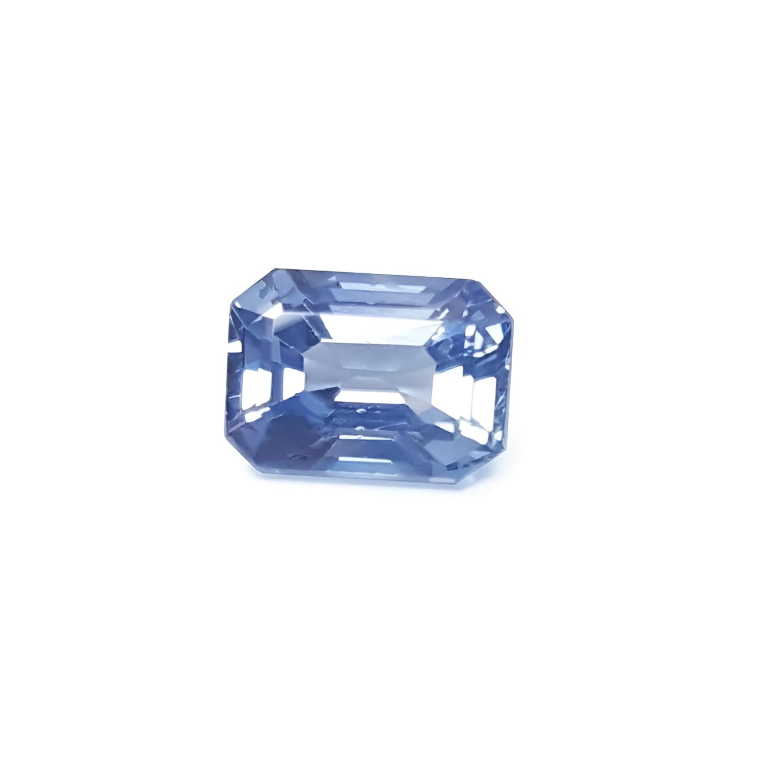 Genuine loose sapphire medium light blue emerald-cut, it is sparkling, crystalline, ideal for an affordable sapphire ring.
