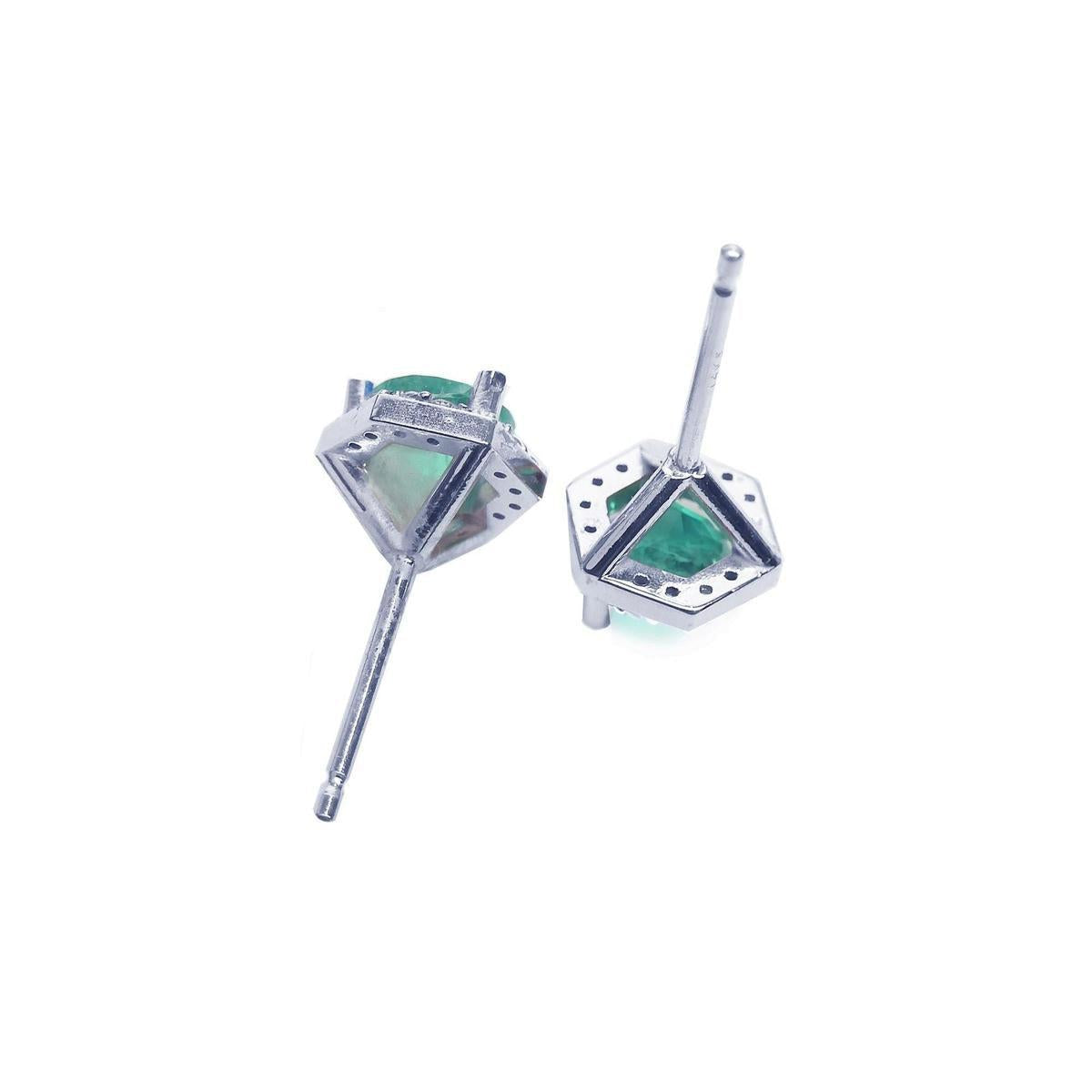 Colombian emerald stud earrings, white gold underside view, push backs system.