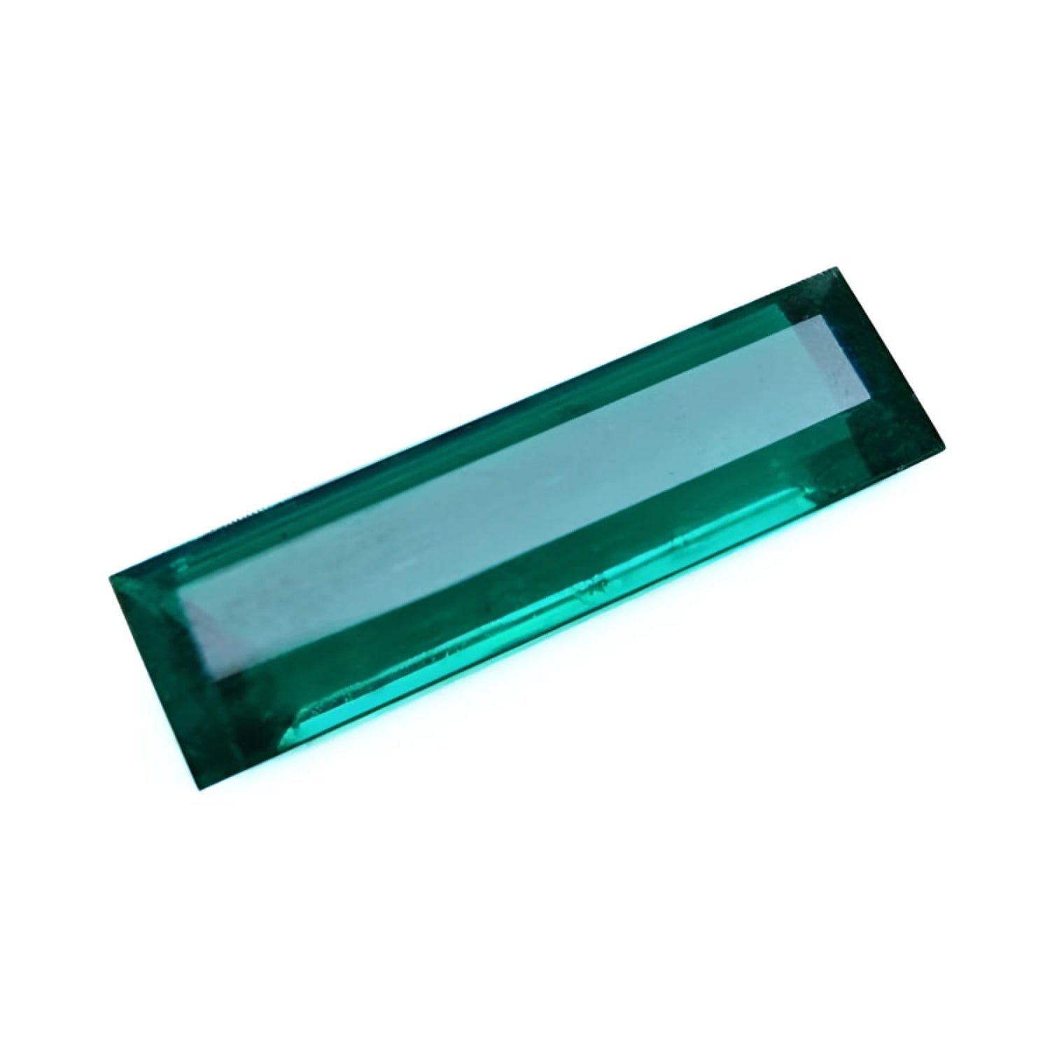 3.13 carat baguette cut Colombian emerald with sparkling bluish-green color.