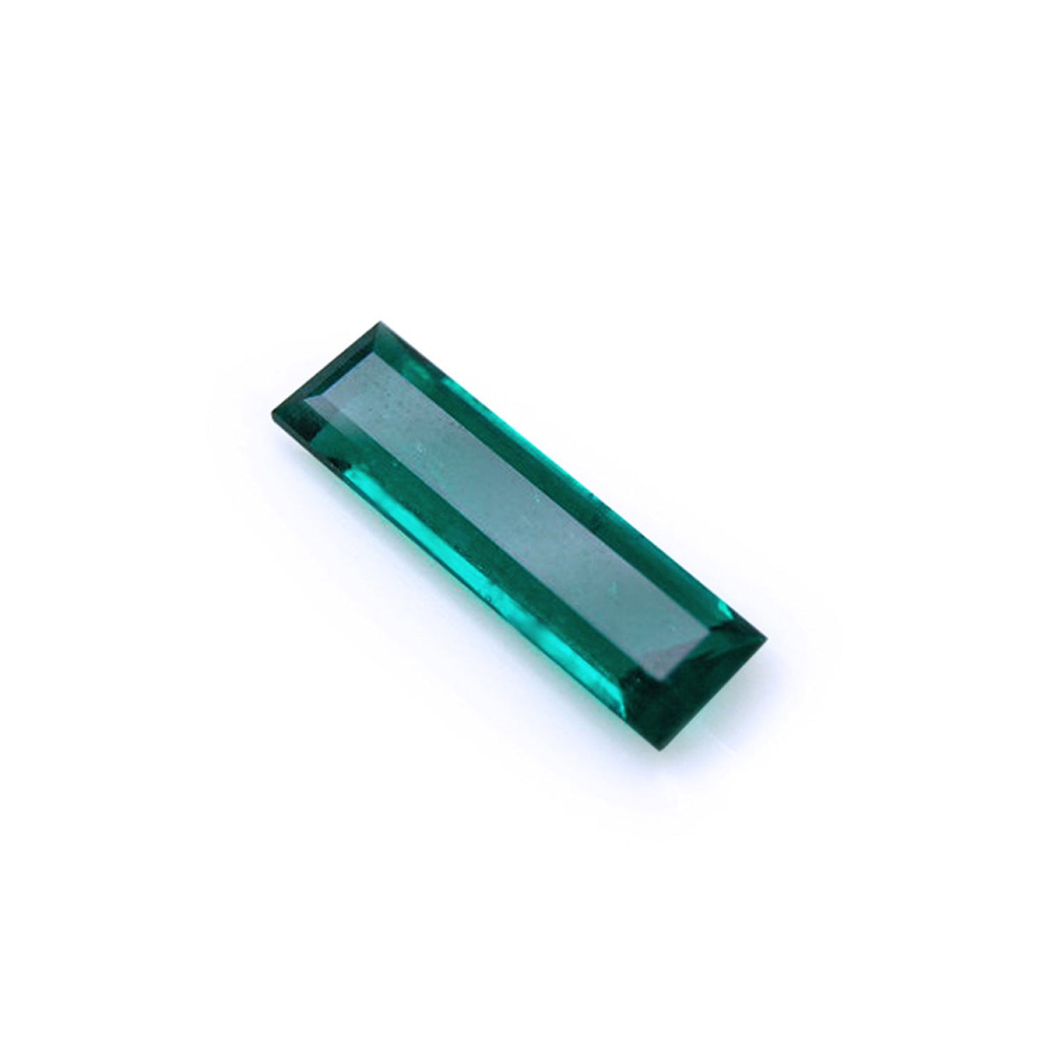 3.13 carat natural Colombian emerald, baguette cut, deep bluish-green, eye-clean.