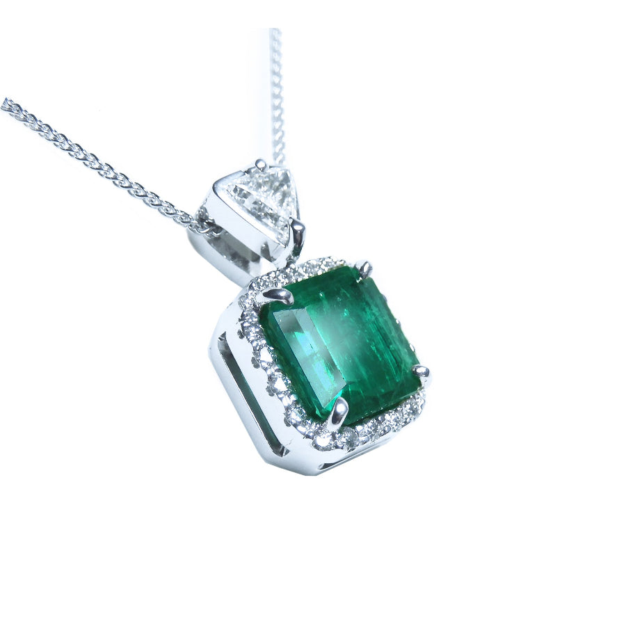 A GIA certified F1 colombian emerald pendant, crafted in 18k white gold.