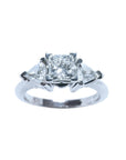 This GIA-certified radiant cut diamond ring features a 0.77 ct center stone and 0.47 ct trillion-cut side stones, for a total weight of 1.24 ct. 