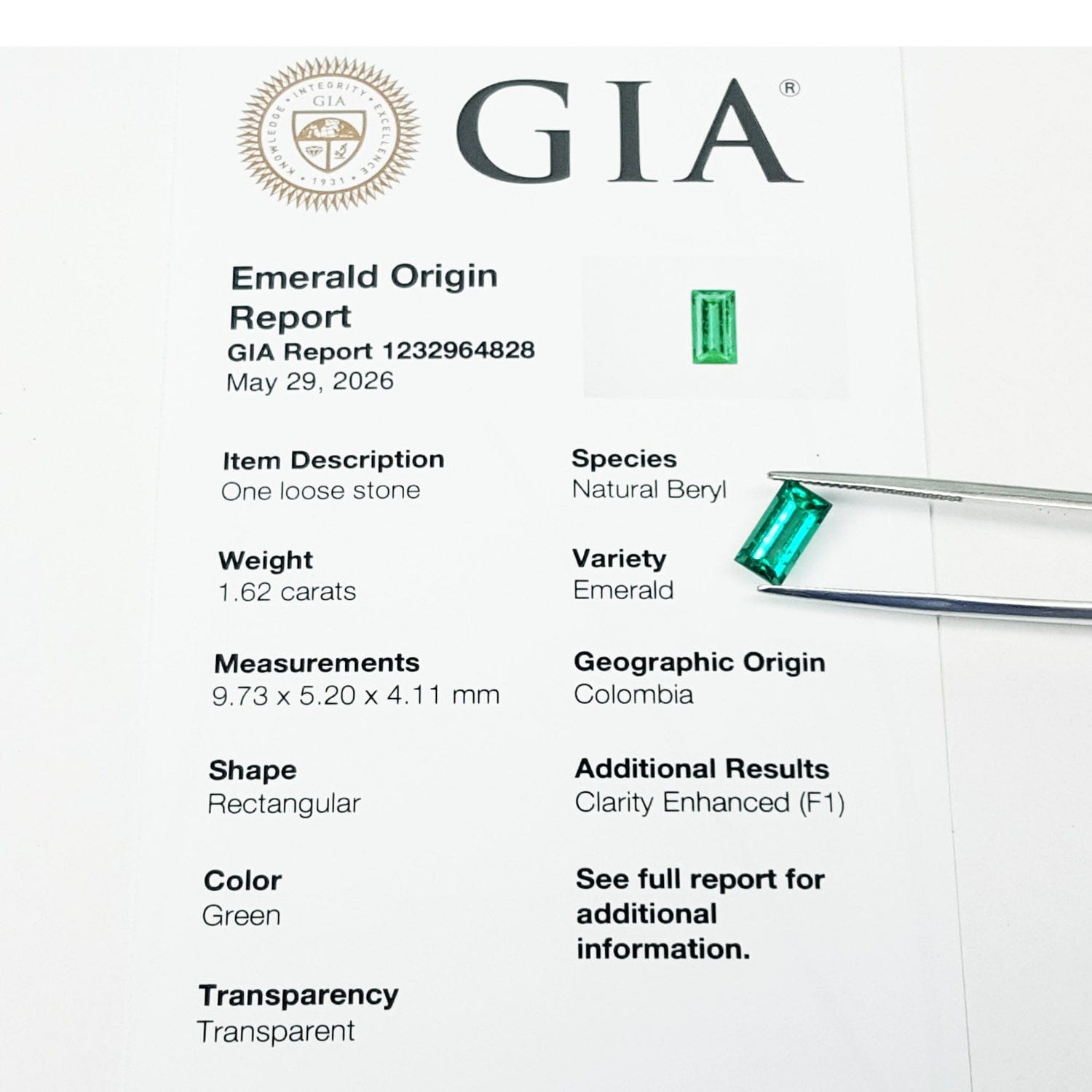 GIA emerald origin report with a green gemstone held by tweezers.