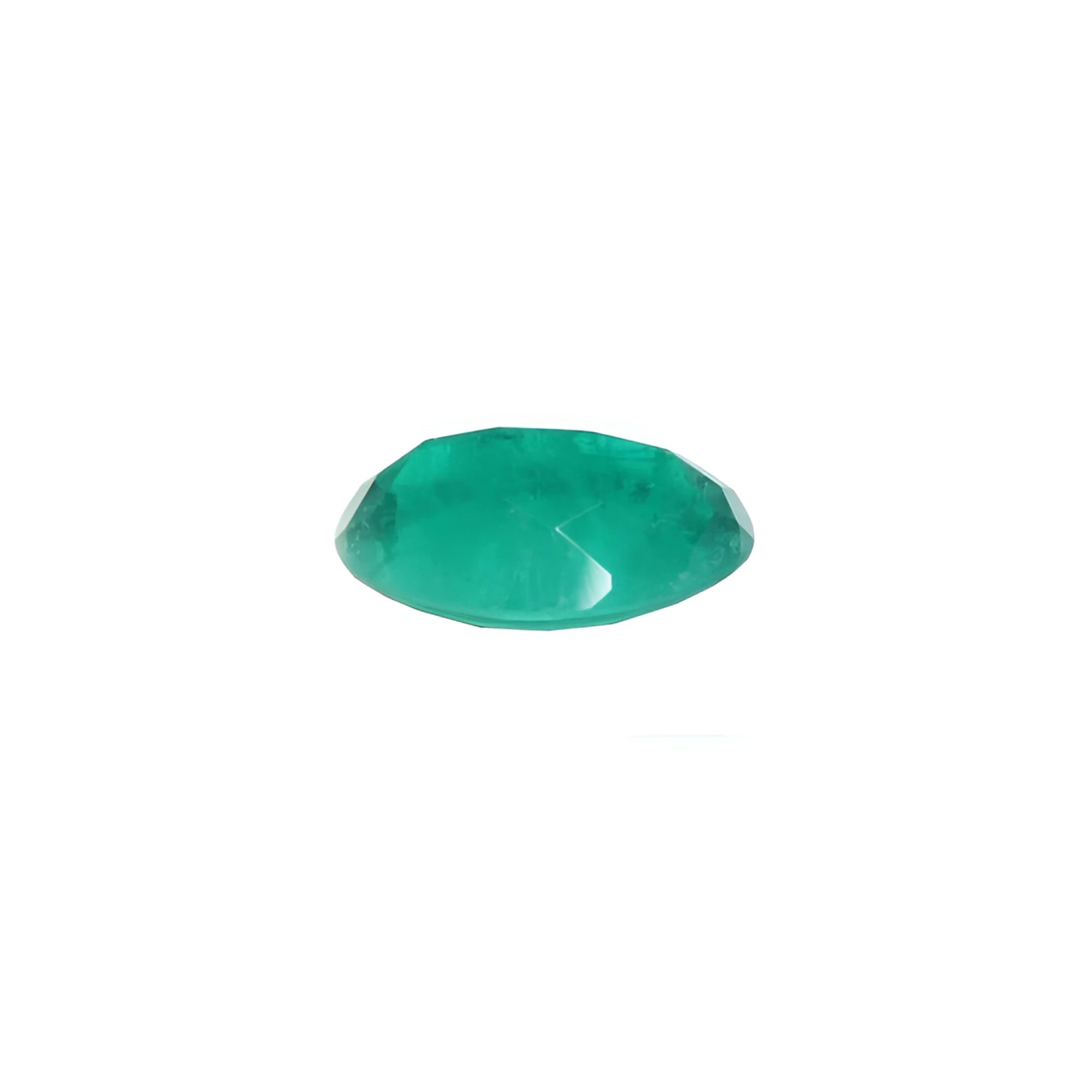 3.68 ct GIA certified oval emerald from Colombia, displaying a bright bluish-green color.