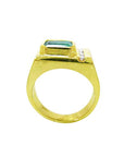 For men a gold ring with a square emerald on a lateral profile position.