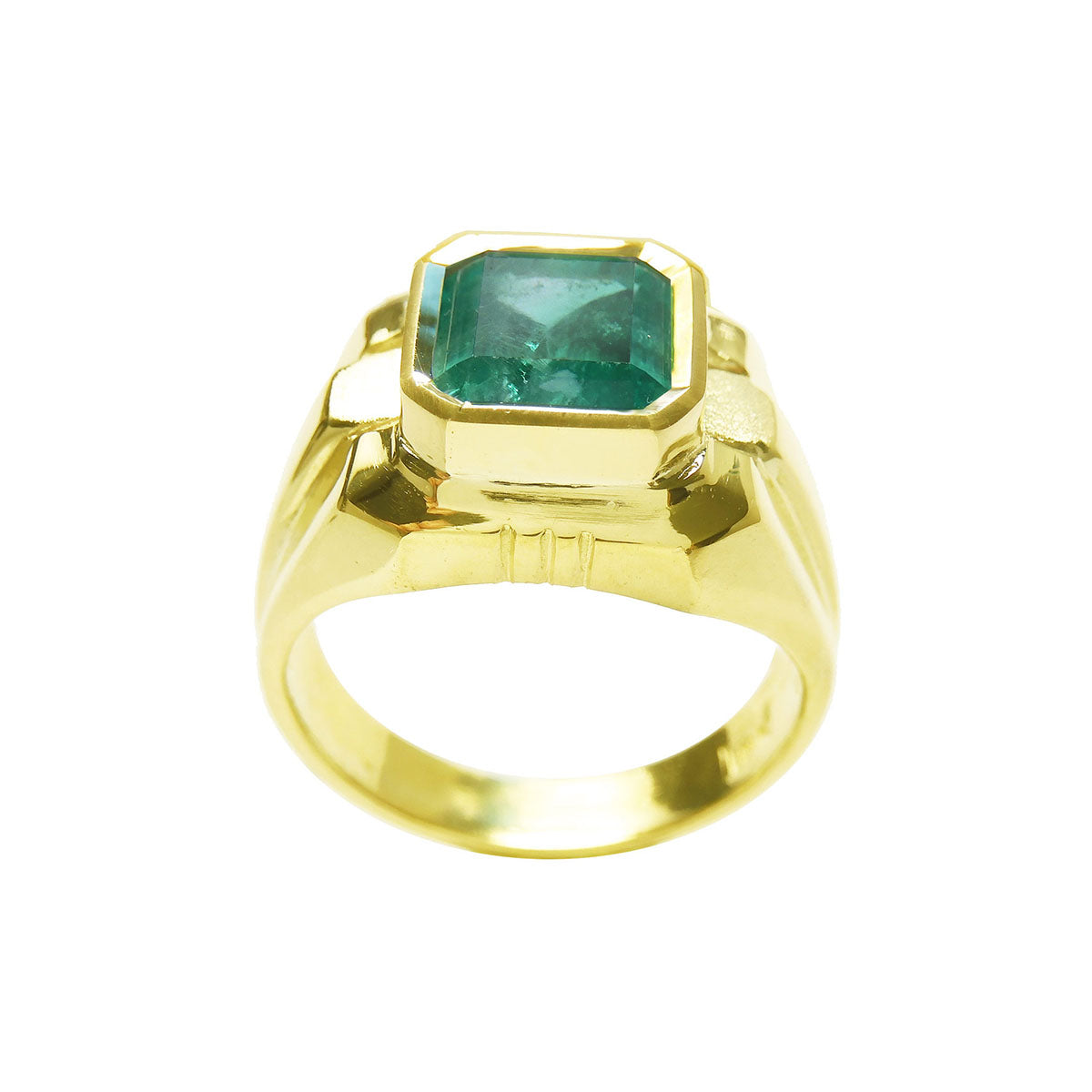 Gold ring for men with a natural emerald on a white background