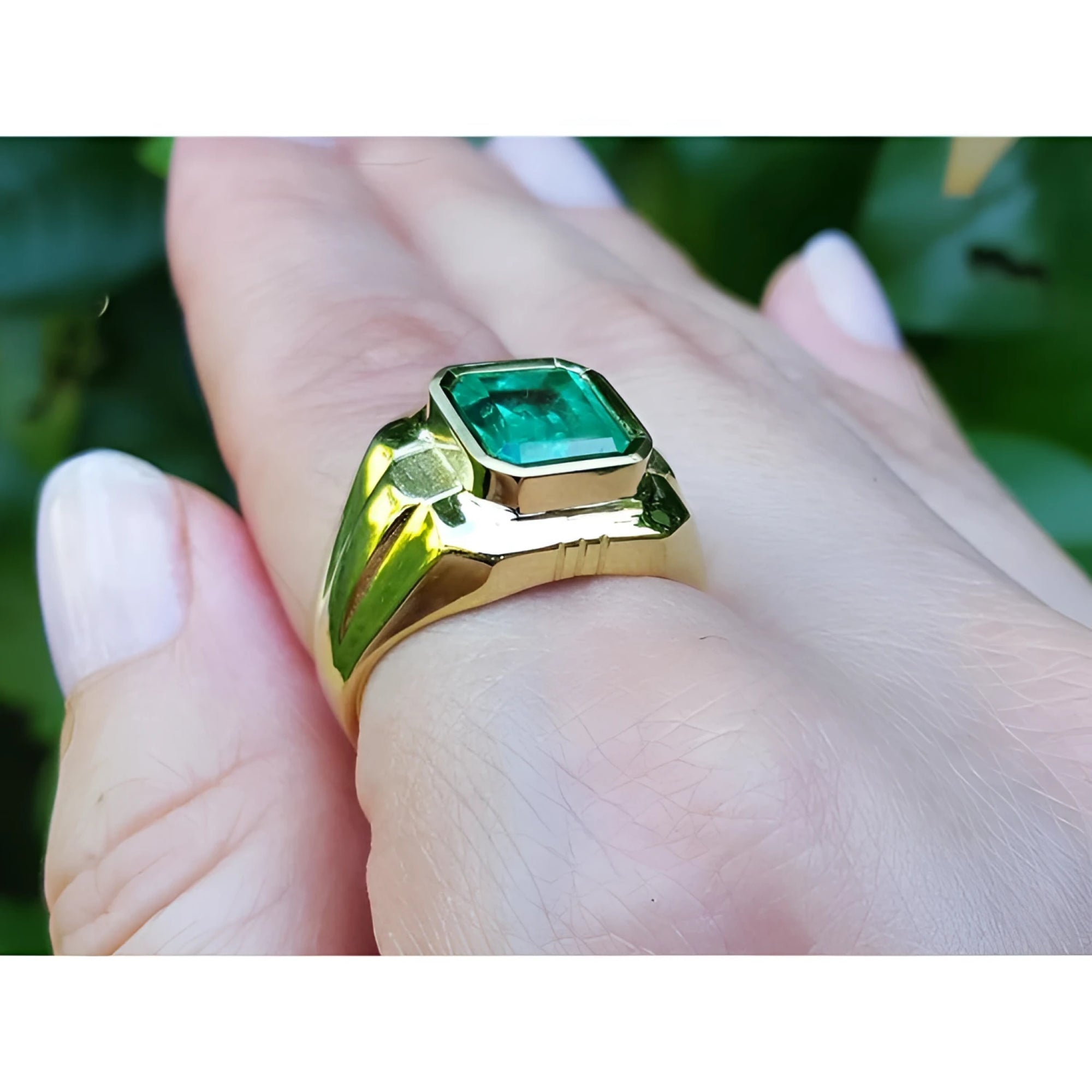 18K yellow gold men's solitaire ring with a square emerald cut Muzo Colombian emerald in a full bezel setting.