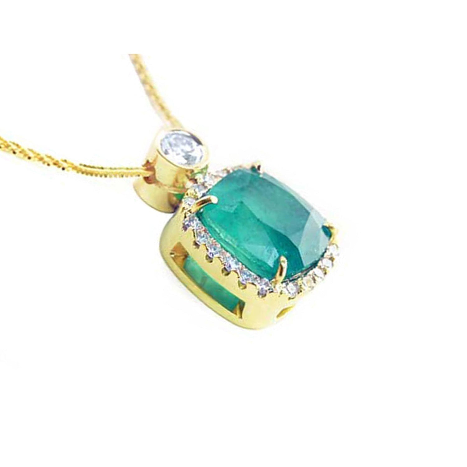 Cushion-cut emerald pendant with diamond halo on an 18K yellow gold chain.
