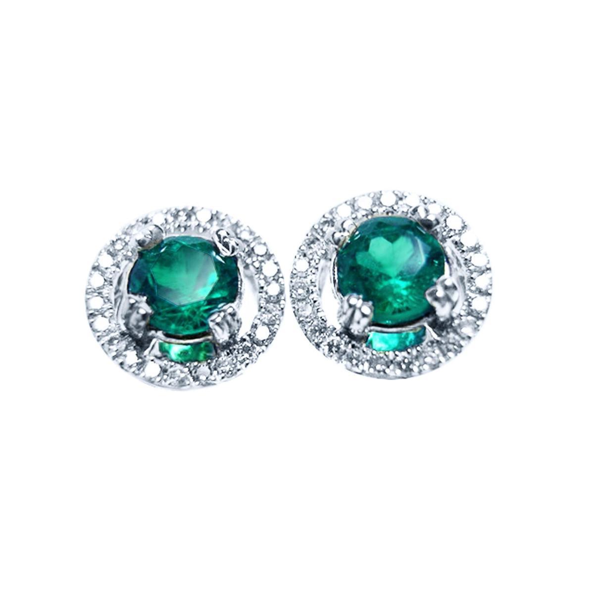 Pair of halo diamond emerald stud earrings, top view on a front position