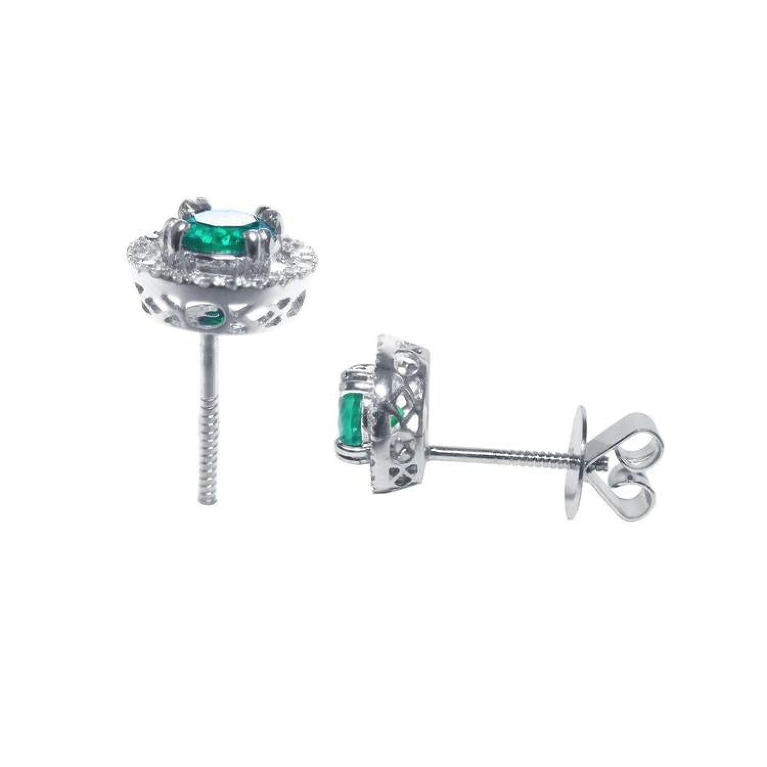 1.06 ct deep bluish-green emerald stud earrings in 14K white gold with diamond halo and screw backs.