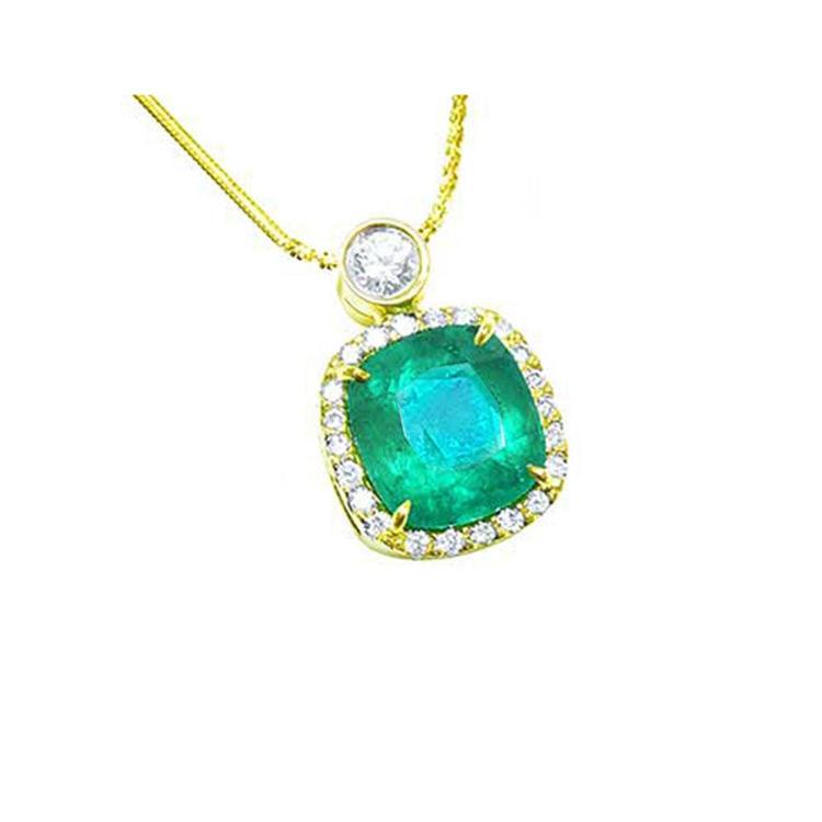 Natural emerald necklace 8.07 carats encircled in a halo of natural diamonds 18k yellow gold.