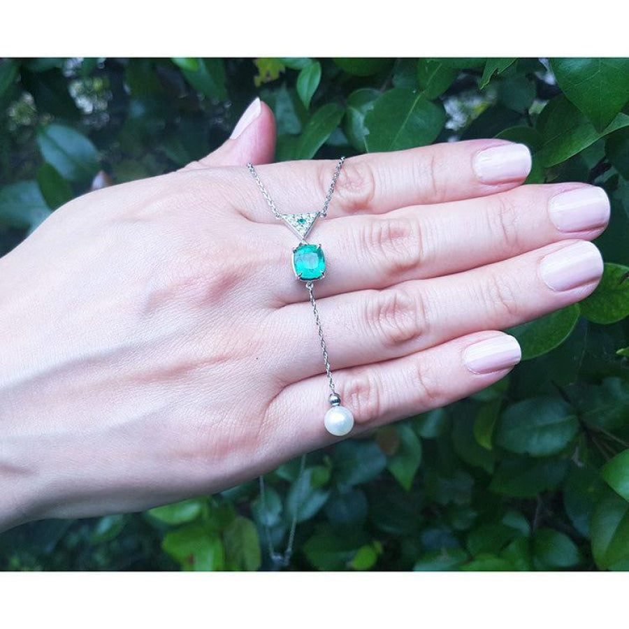 1.91 carat emerald cushion cut necklace with a hanging white freshwater pearl on 14K white gold.