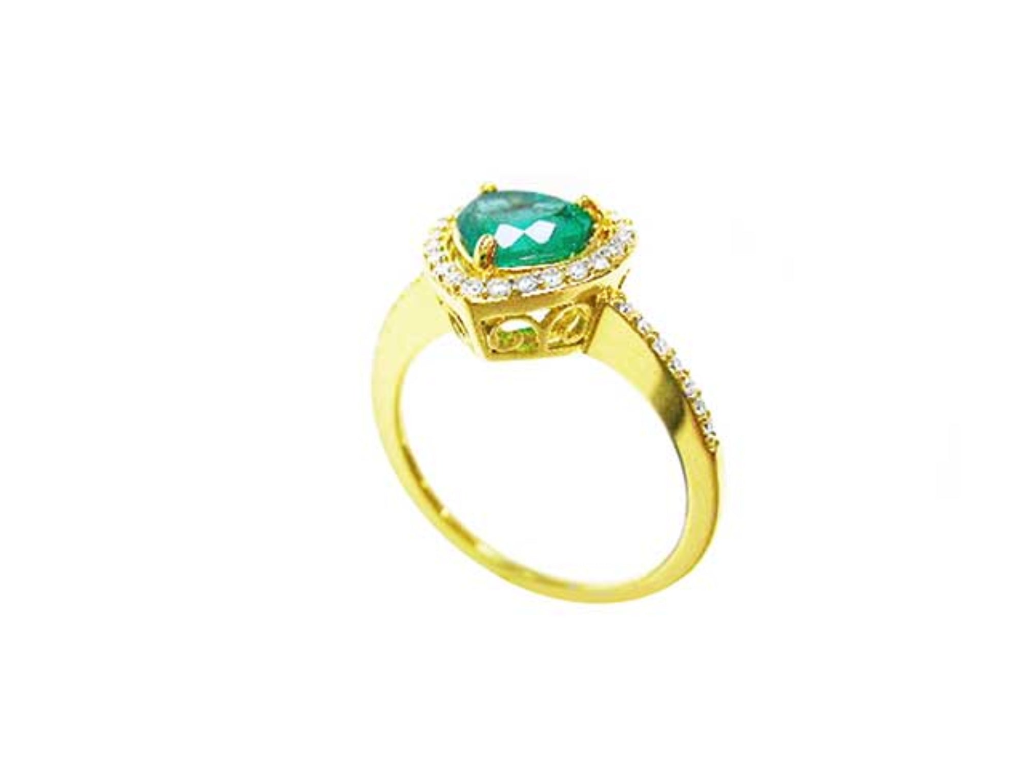 From a partial side angle perspective, a heart cut emerald engagement ring halo diamonds 14k yellow gold.
