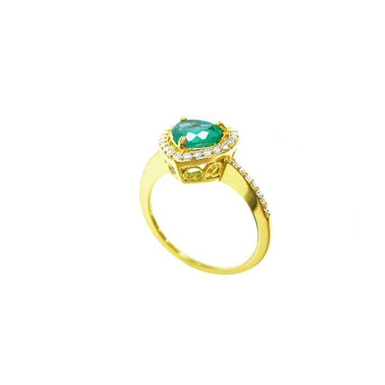Heart-cut emerald ring with diamond halo and pavé band in 14K yellow gold.