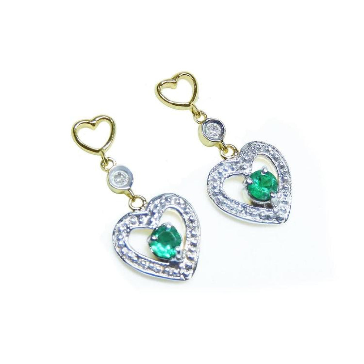 Pair of emerald heart earrings with round cut emeralds in 14k yellow gold.