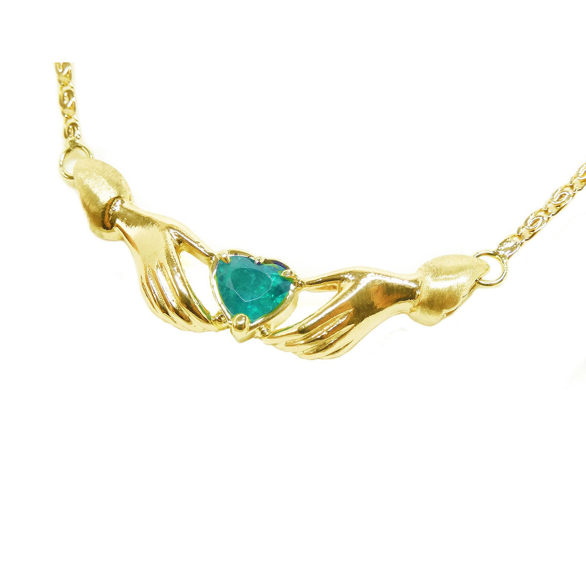 14k yellow gold Claddagh necklace with a heart-shaped green gemstone on a white background