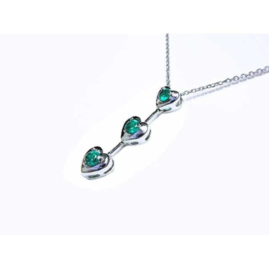 14K white gold heart journey pendant necklace with three round Colombian emeralds.