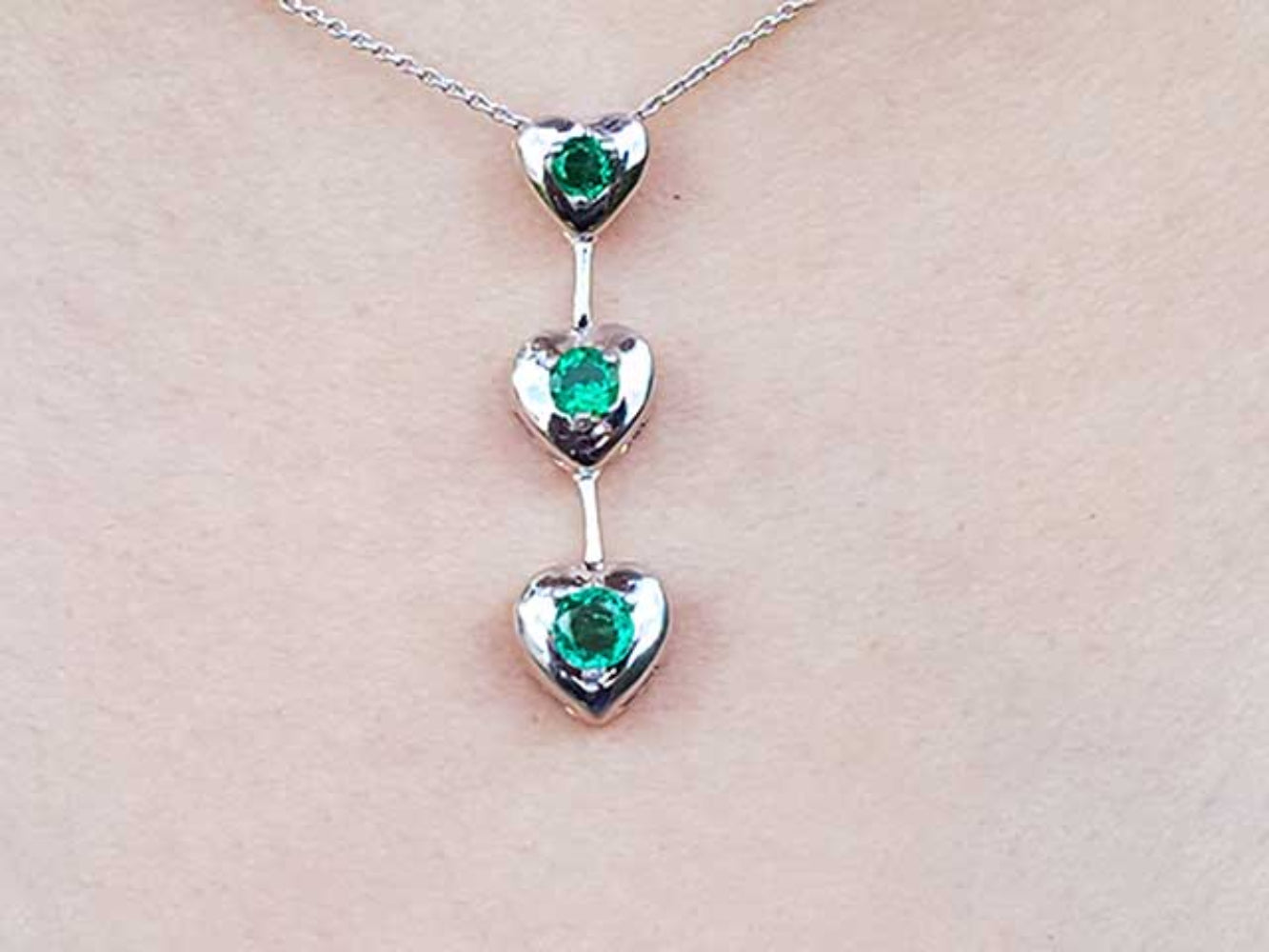 Round cut natural emeralds journey necklace heart pendant.