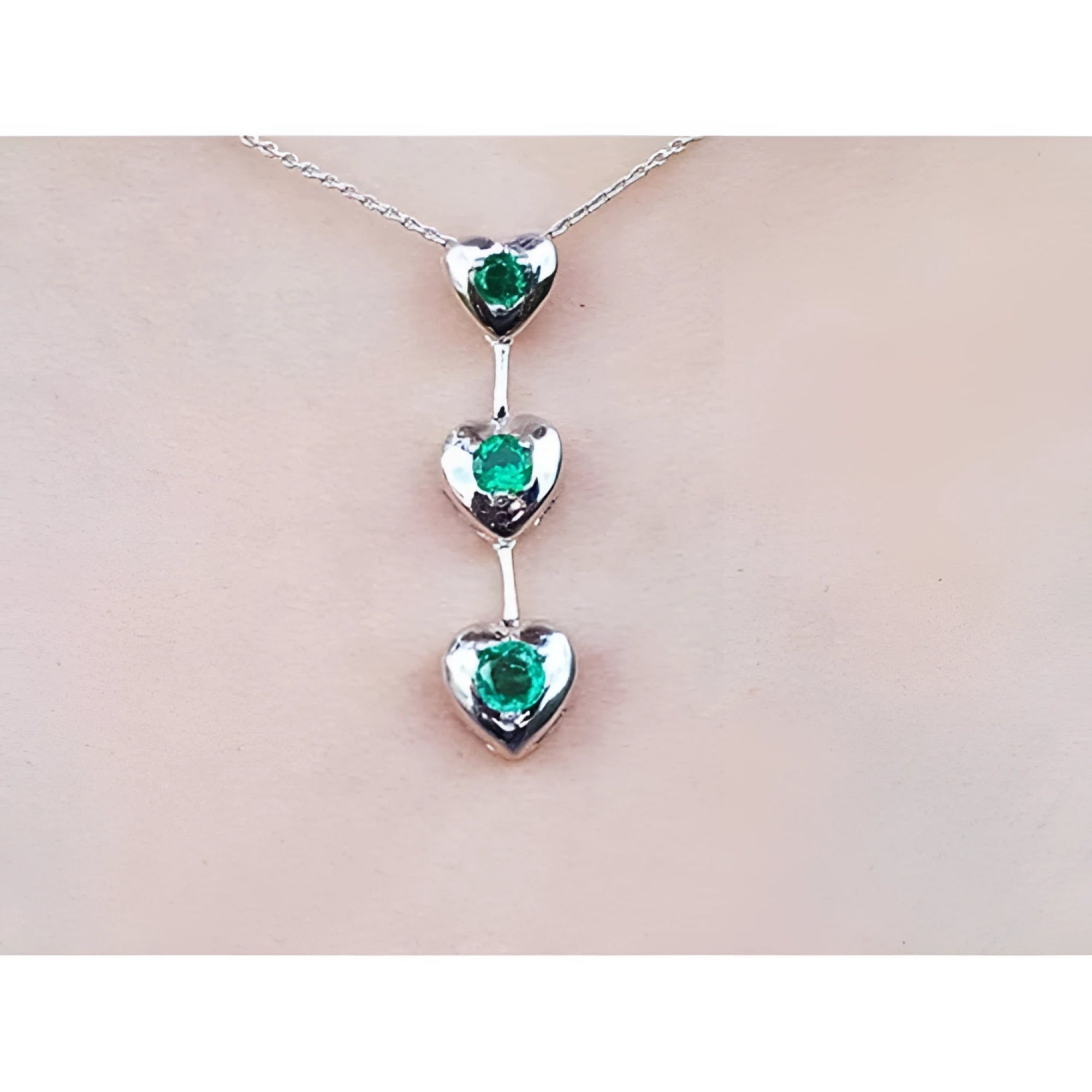 Round cut natural emeralds journey necklace heart pendant.