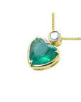 Heart-shaped emerald pendant in 18K yellow gold with a slider bail and bezel-set diamond.