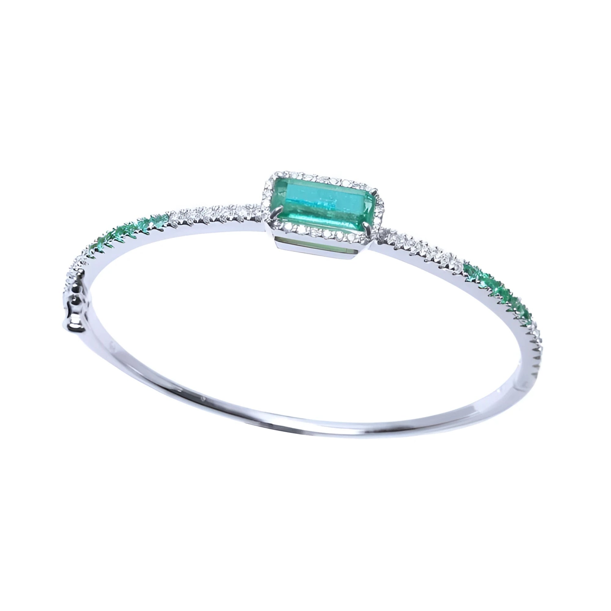 14K white gold bangle bracelet with a large emerald-cut Colombian emerald and natural diamond accents.