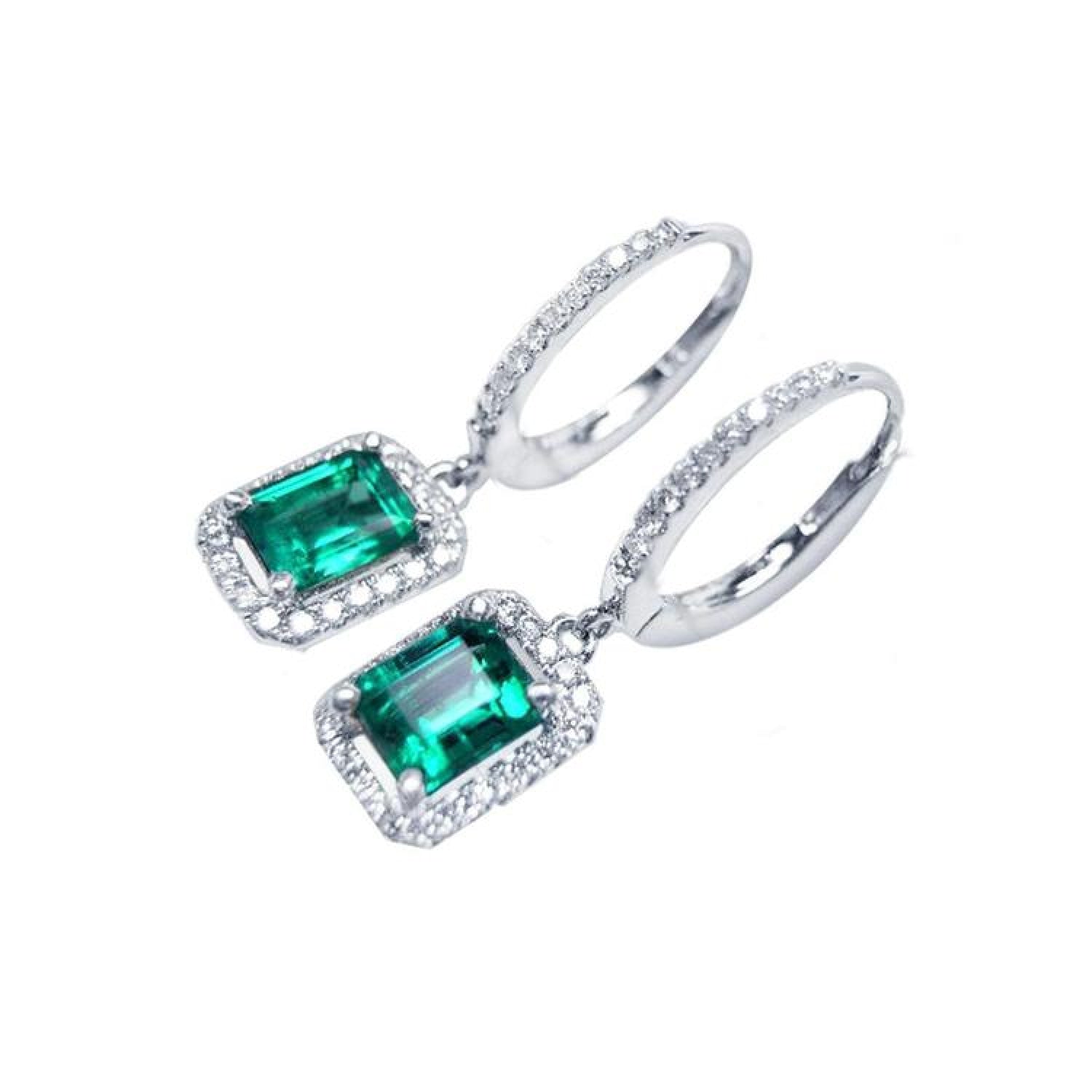 14k white gold dangle hoop earrings with medium deep green emeralds framed by diamonds.