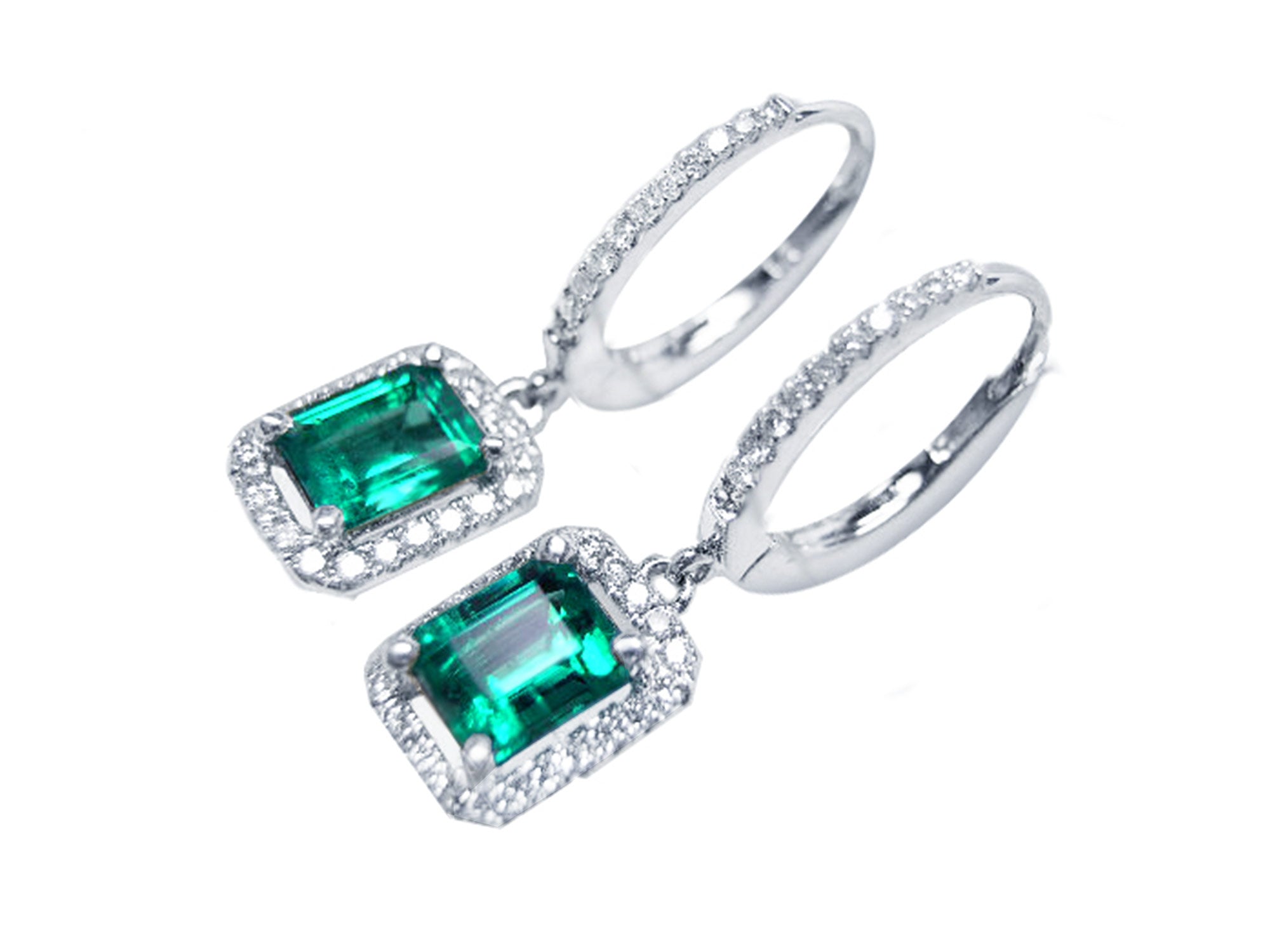 A pair of Muzo Colombian emerald dangle earrings, with halo diamond, left side profile and top visibles.