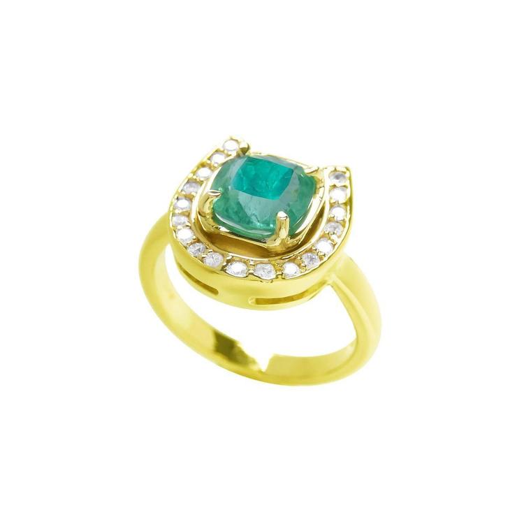 14K yellow gold horseshoe ring with a cushion-cut emerald and surrounding diamonds.