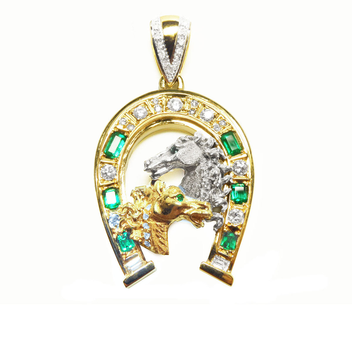 Gold pendant with horse design and emerald stones natural diamonds on a topside view position.