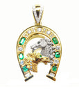 Gold pendant with horse design and emerald stones natural diamonds on a topside view position.
