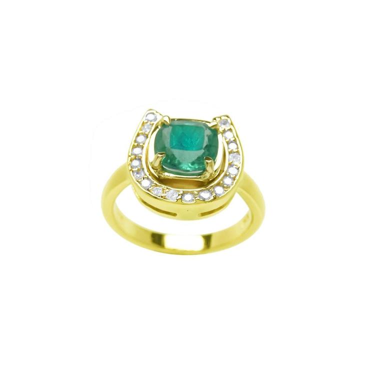 This yellow gold ring showcases a cushion-cut emerald set at the center of a horseshoe-shaped diamond design.