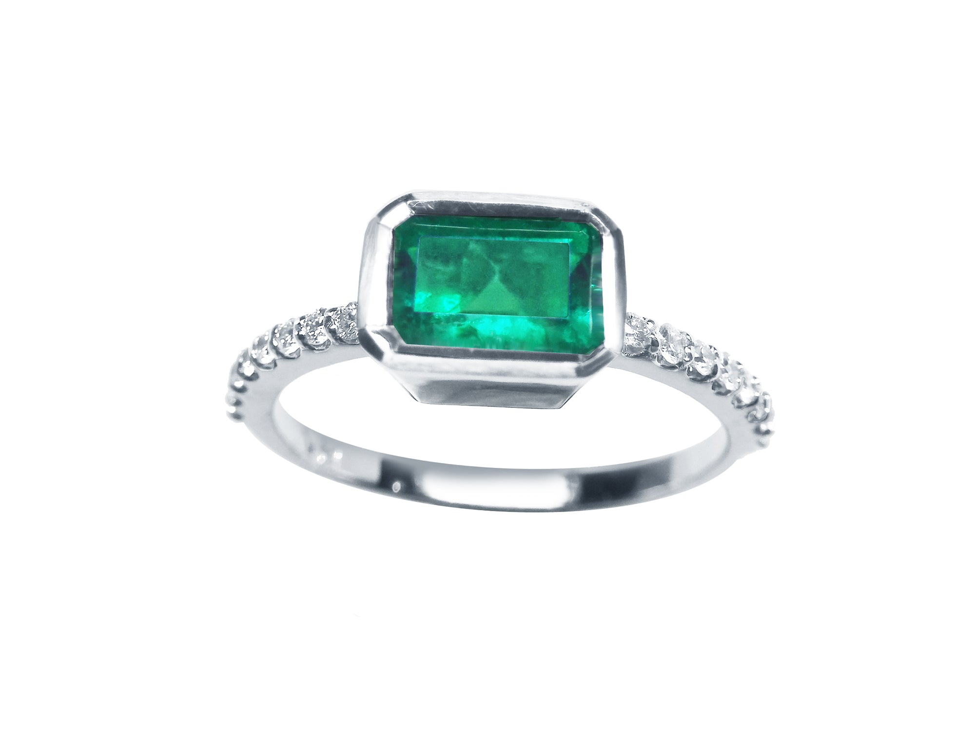 This inexpensive emerald ring displays the topside view of the bezel set emerald and accent diamonds on the band.