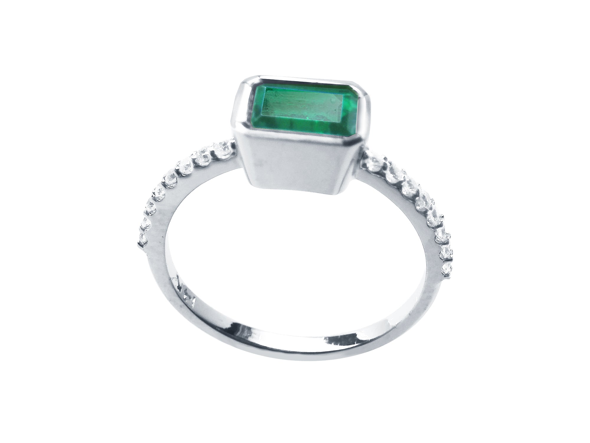 A detailed view of an emerald and accent diamonds ring, highlighting the top, side gallery, and band.