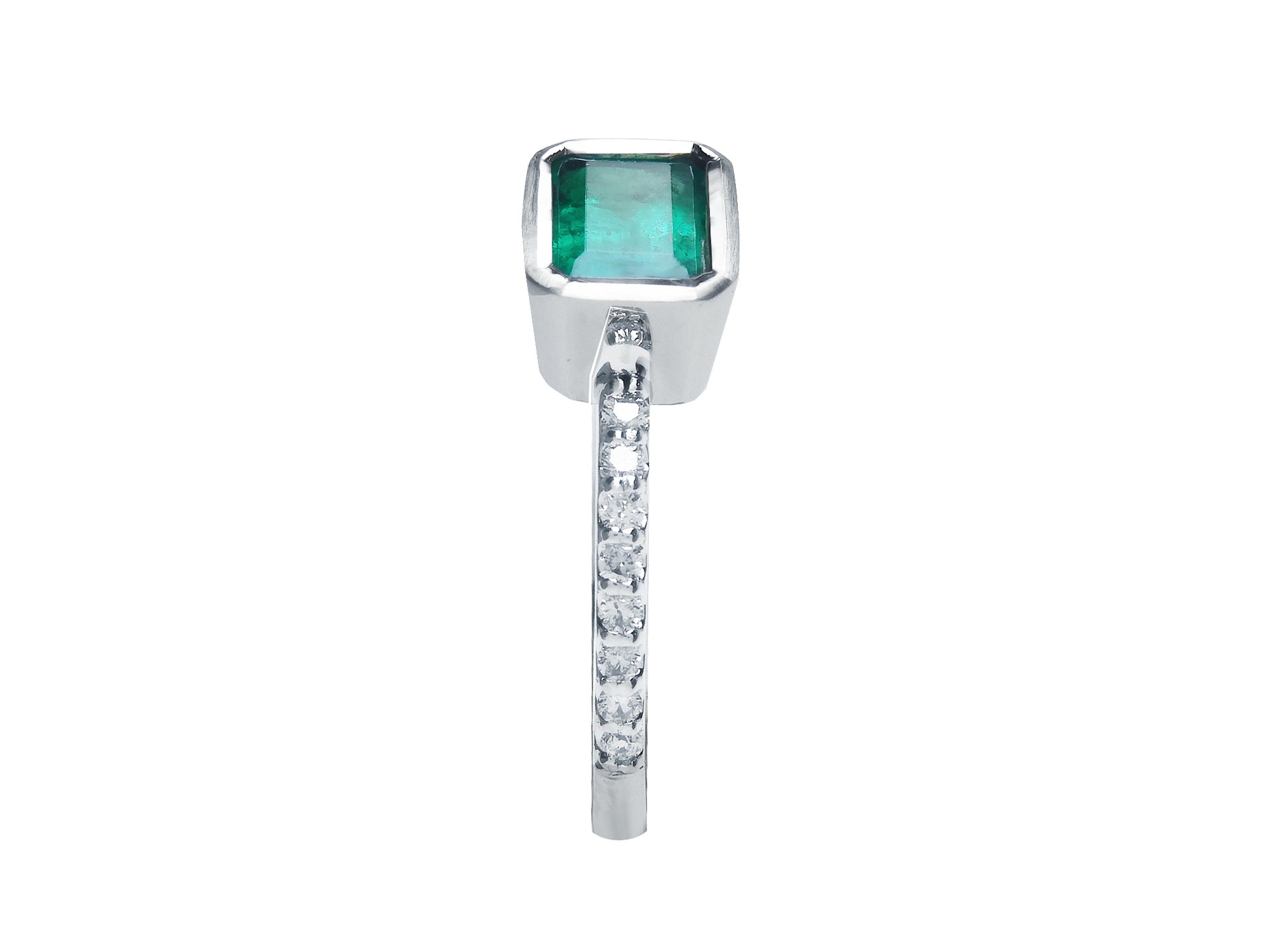 A bezel set emerald and diamond-studded band ring perspective.