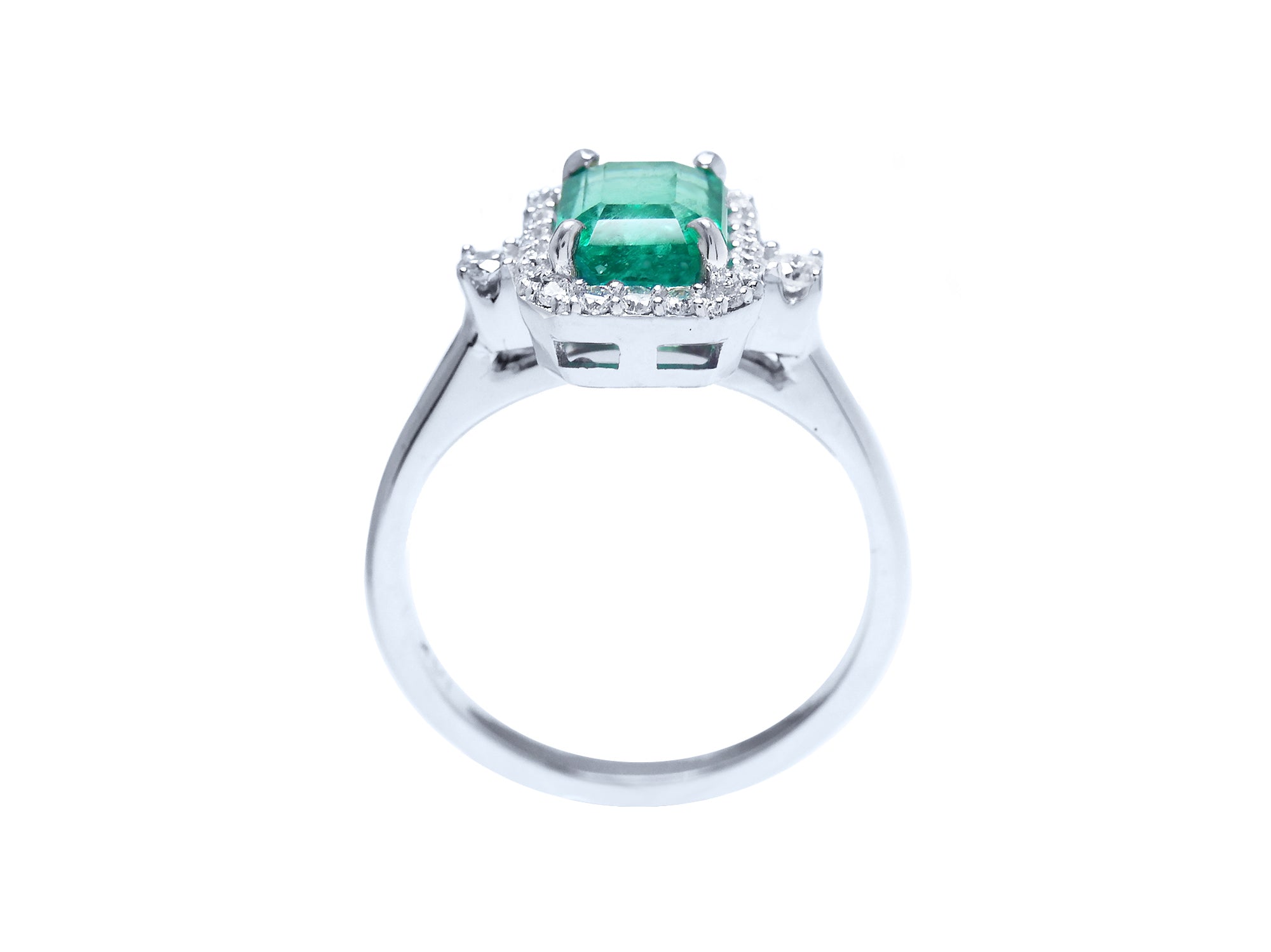 This image shows an affordable emerald engagement ring shows the top, gallery and band design.