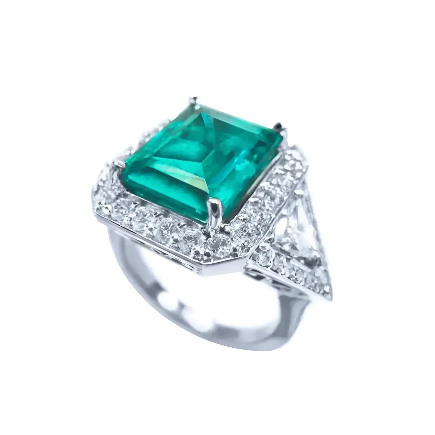 Anillo de oro blanco 18K con esmeralda colombiana rectangular de 3.98 ct y diamantes.